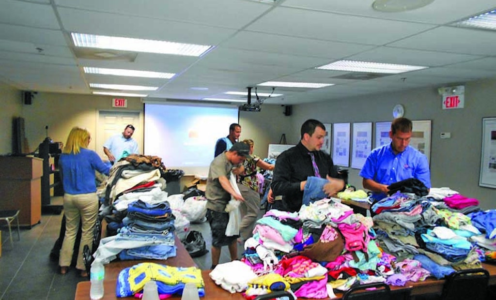 Vac-Con employees collect clothing, school supplies